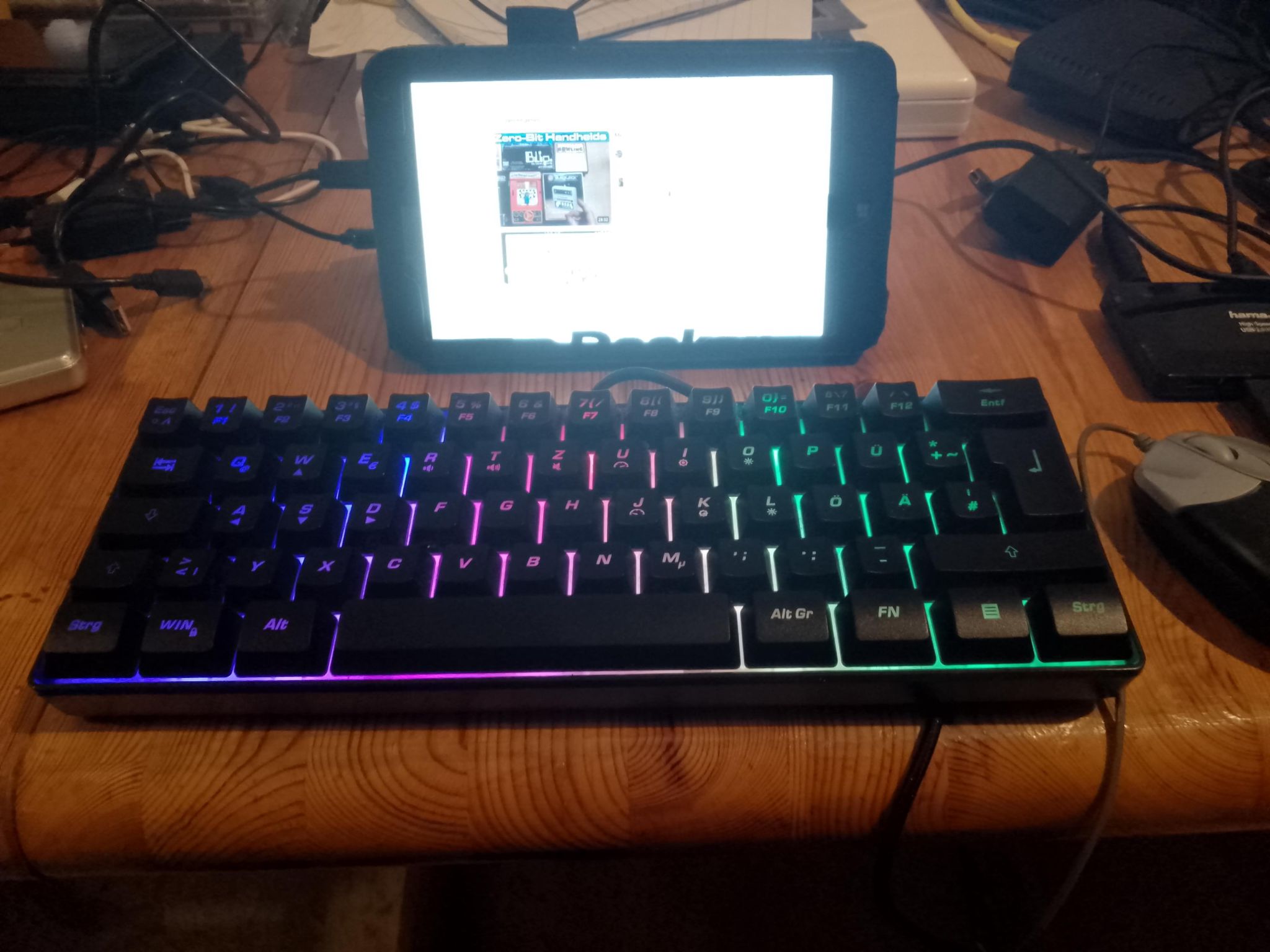 HP Stream 7 tablet. In the foreground: USB keyboard and USB mouse.
The screen shows an X11 session in landscape mode:
* Firefox showing youtube.com
* Decker window
* Xterm window