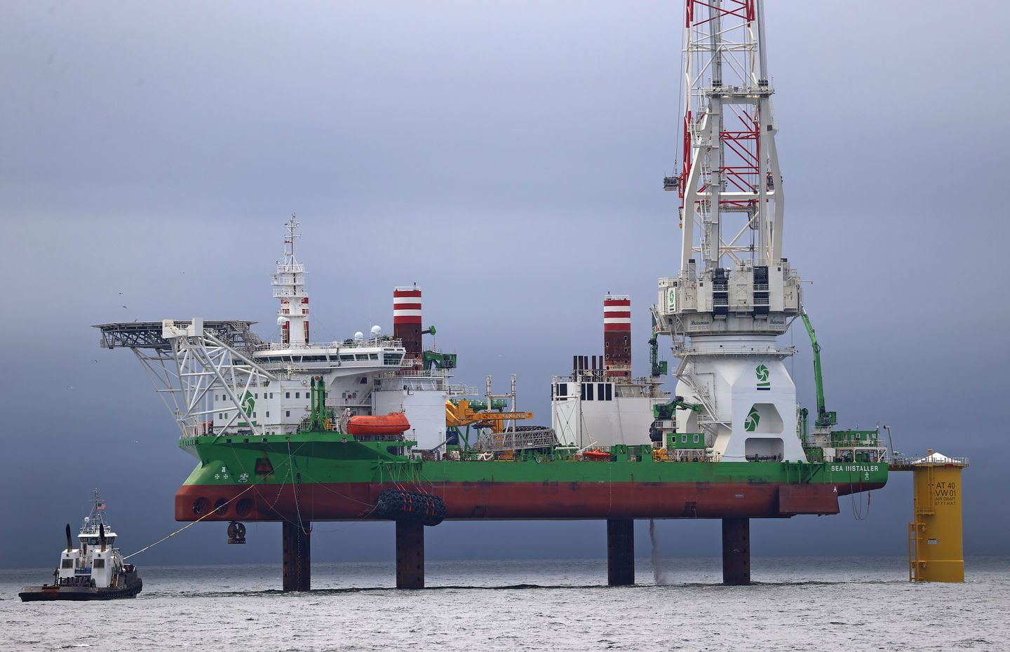 The Sea Installer is a Danish ship with legs that can anchor to the ocean floor and a massive crane that's used to install offshore wind turbines.