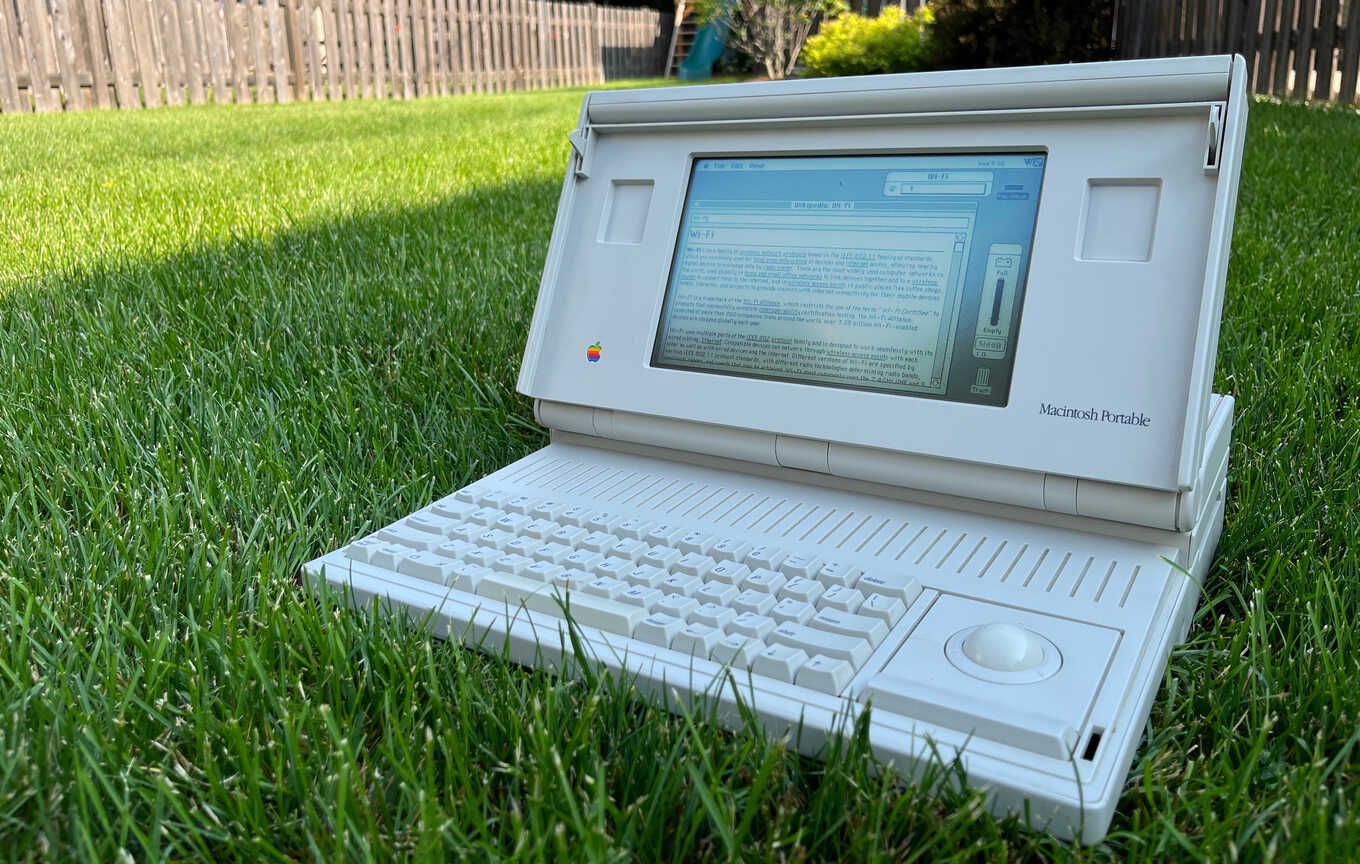 Macintosh Portable M5126. It's very Macintosh and hardly portable. Outside on the lawn reading the Wi-Fi Wikipedia article.